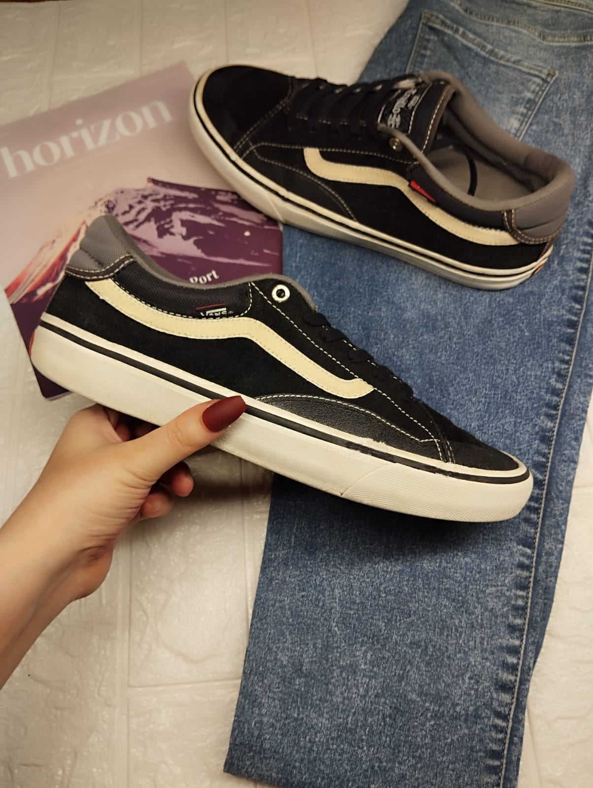 Black and grey low rise vans