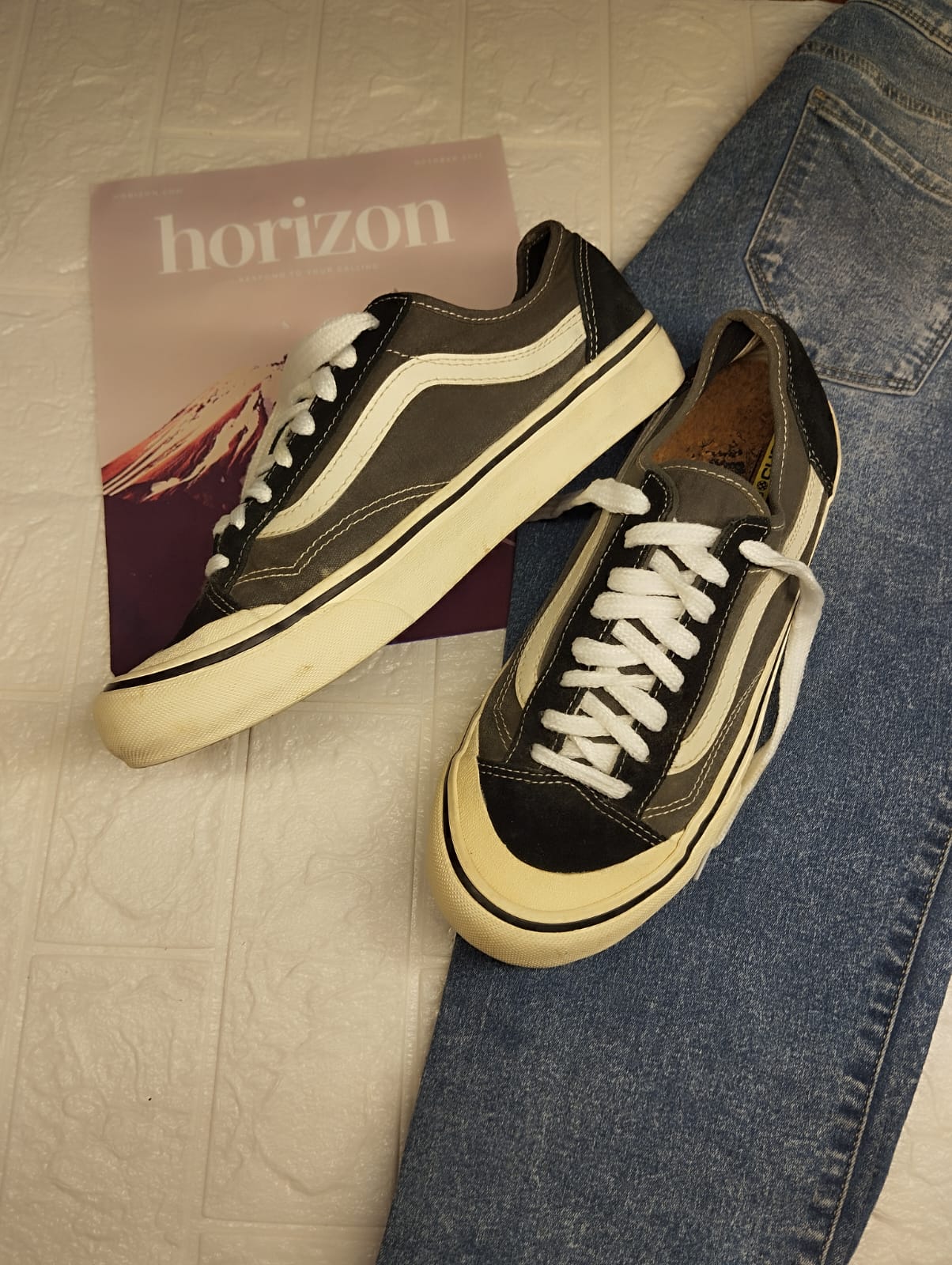 Grey and black low rise vans