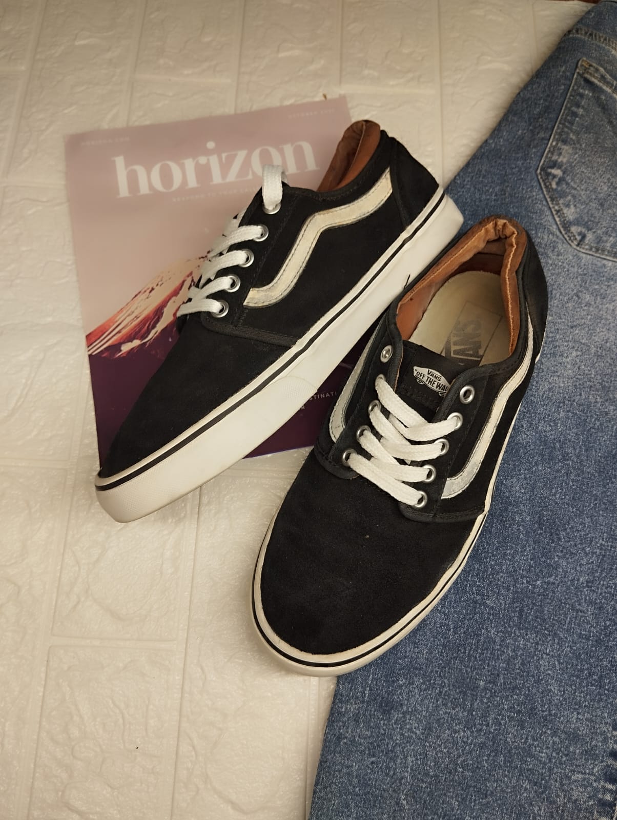 Black and brown low rise vans