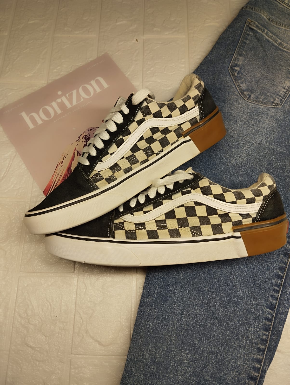 Black checkered low rise vans