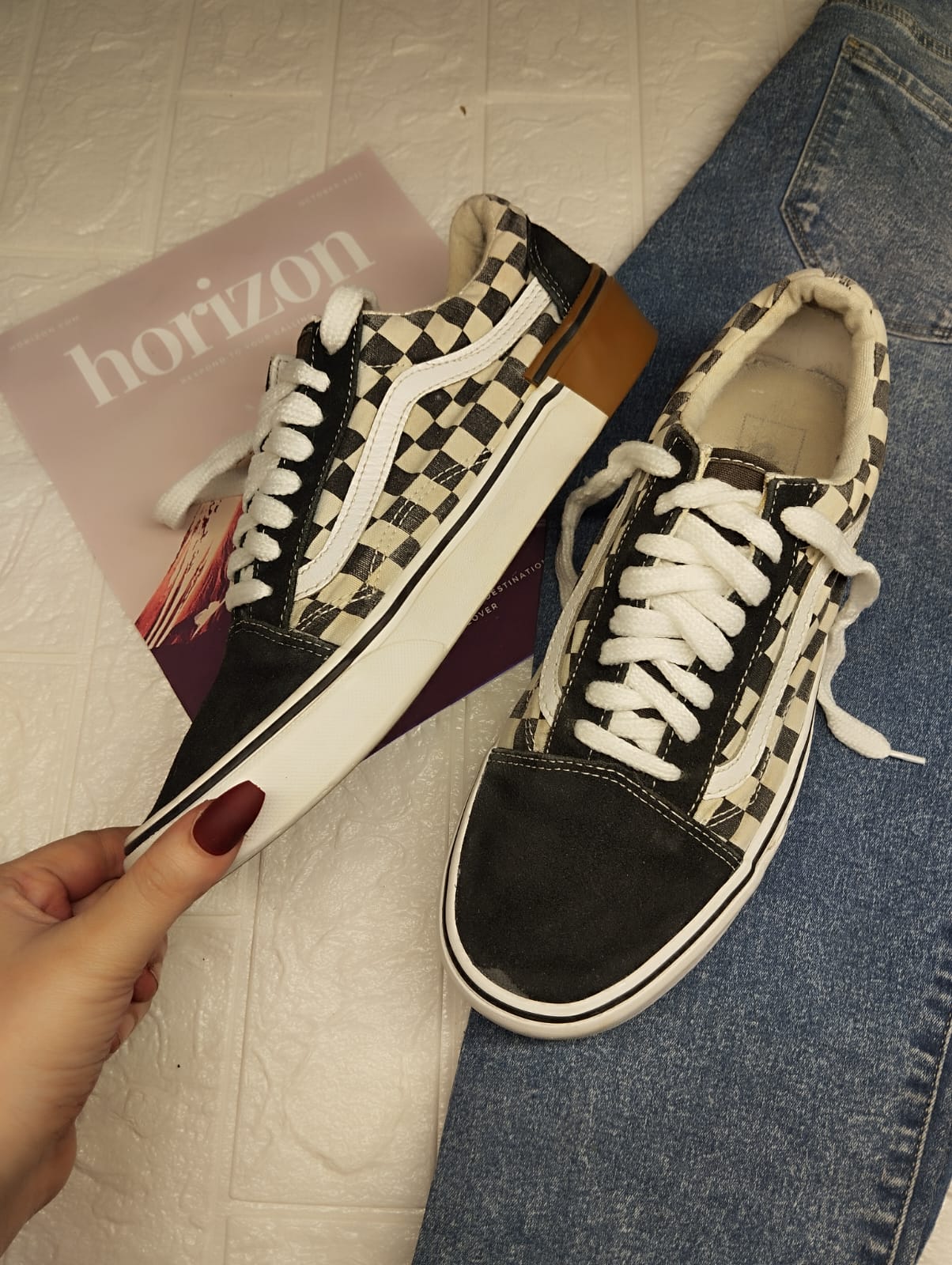 Black checkered low rise vans