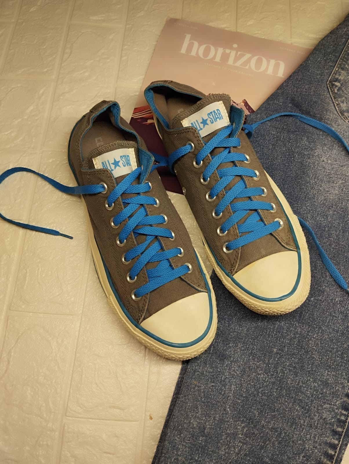 Grey and blue low rise converse