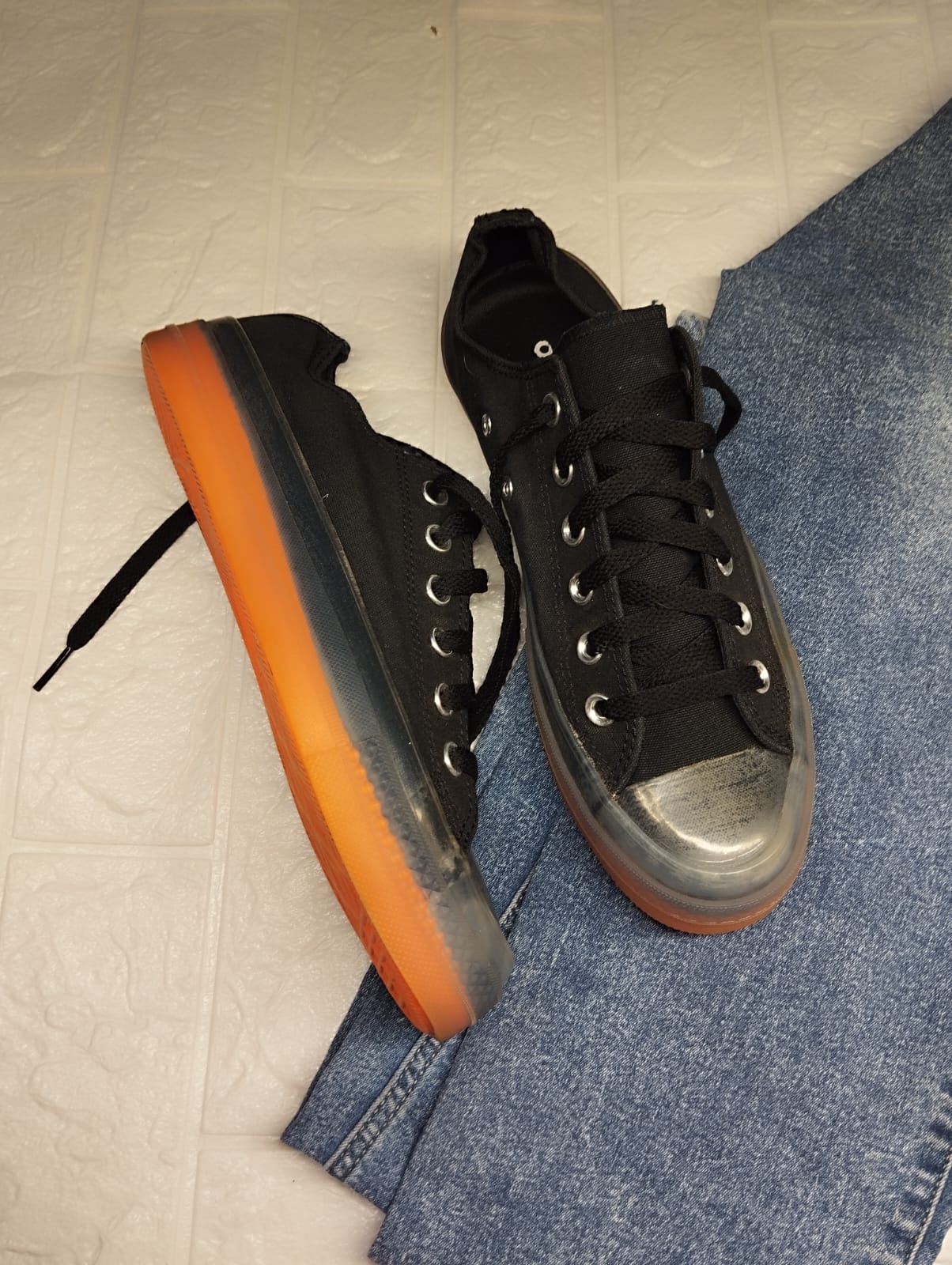 Black and orange low rise converse