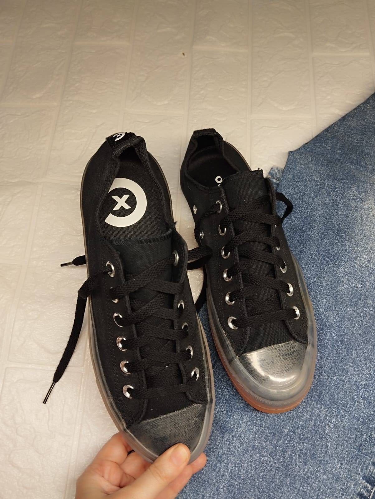 Black and orange low rise converse