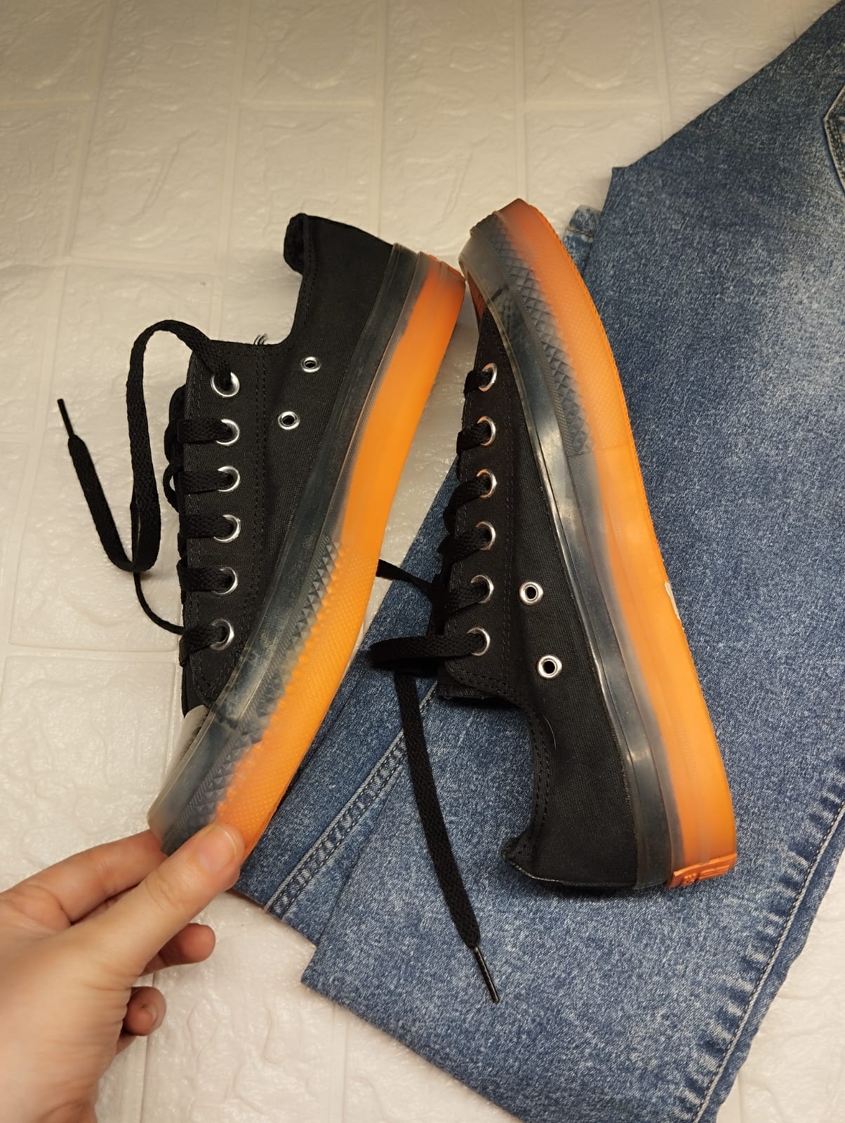 Black and orange low rise converse