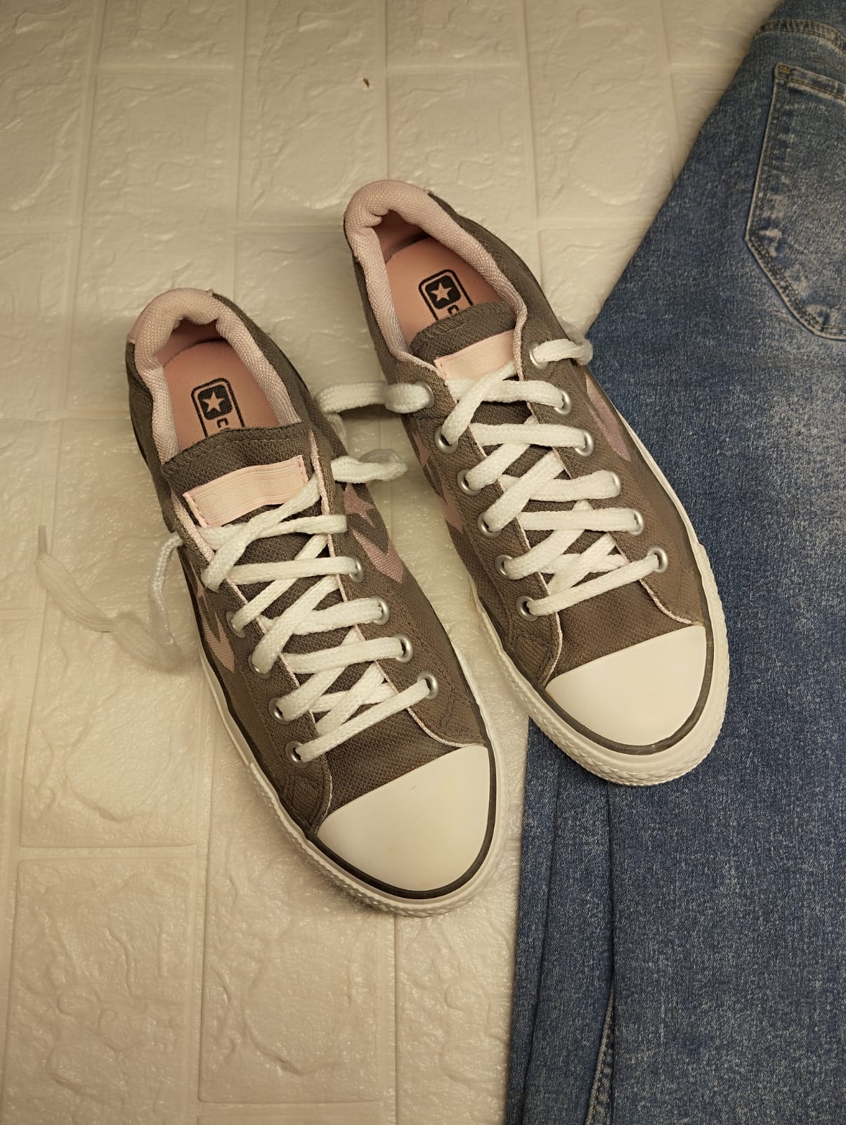 Grey and pink low rise converse