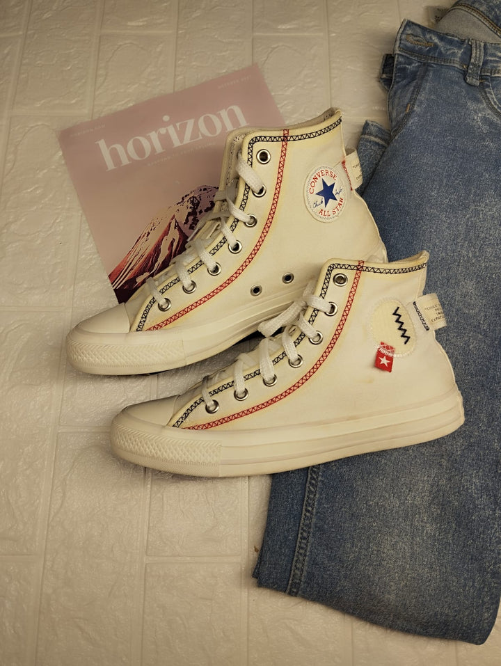 White and orange high rise converse