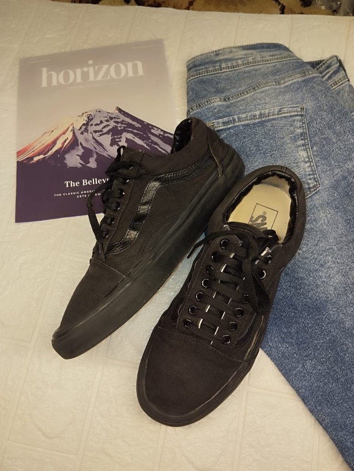 Full black low rise vans