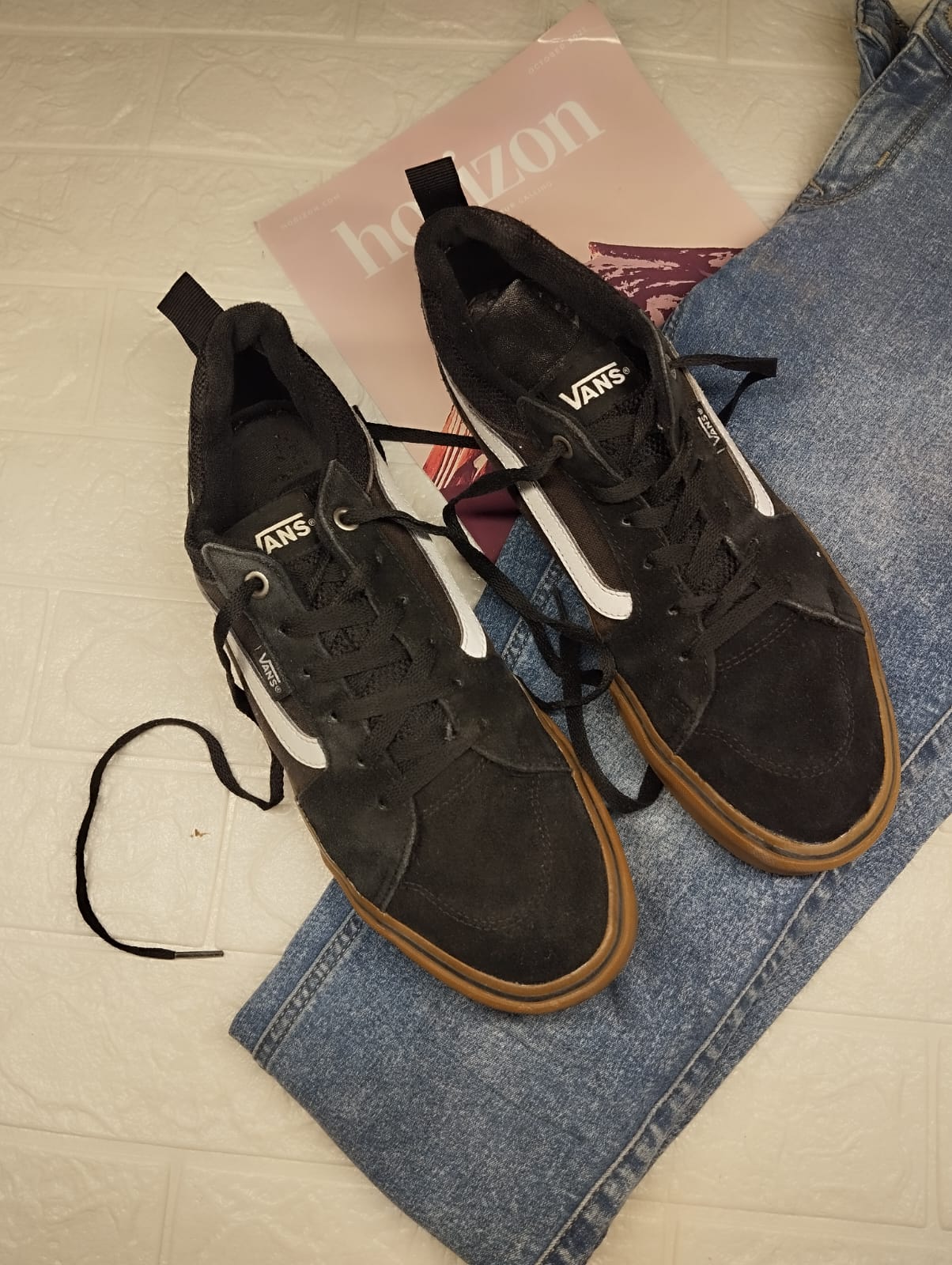 Black and brown low rise vans