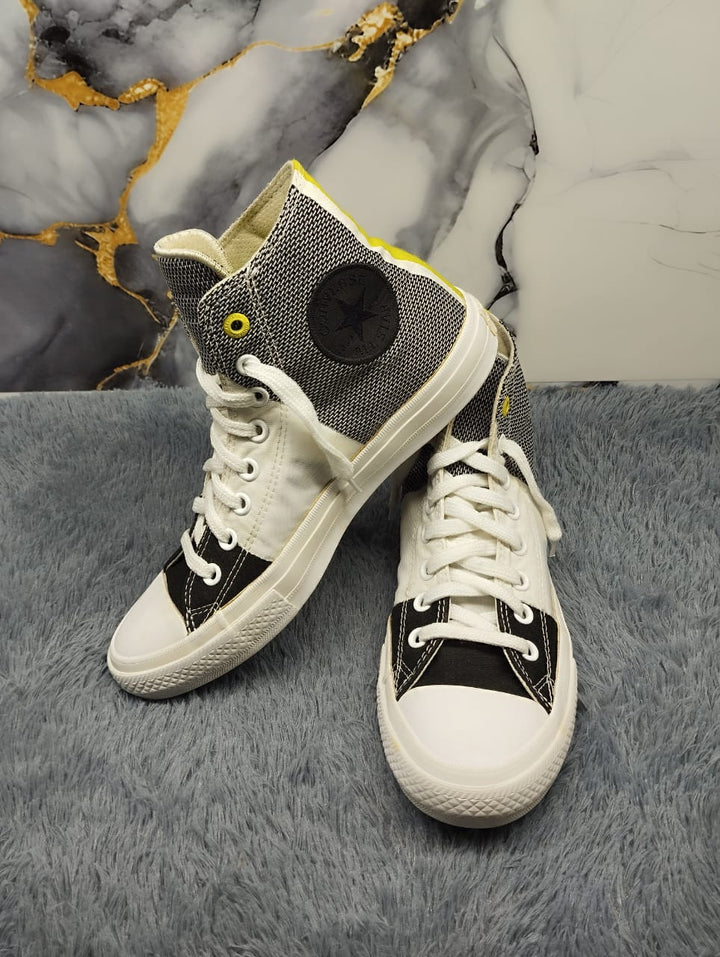 Black and yellow high rise converse
