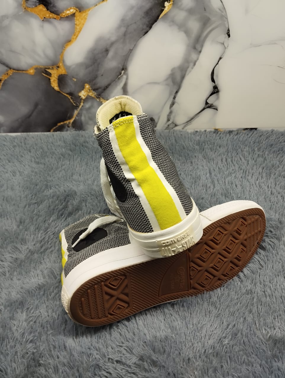 Black and yellow high rise converse