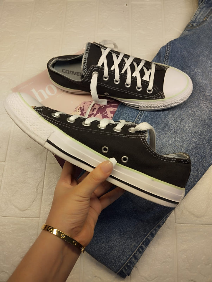 Black and green low rise converse