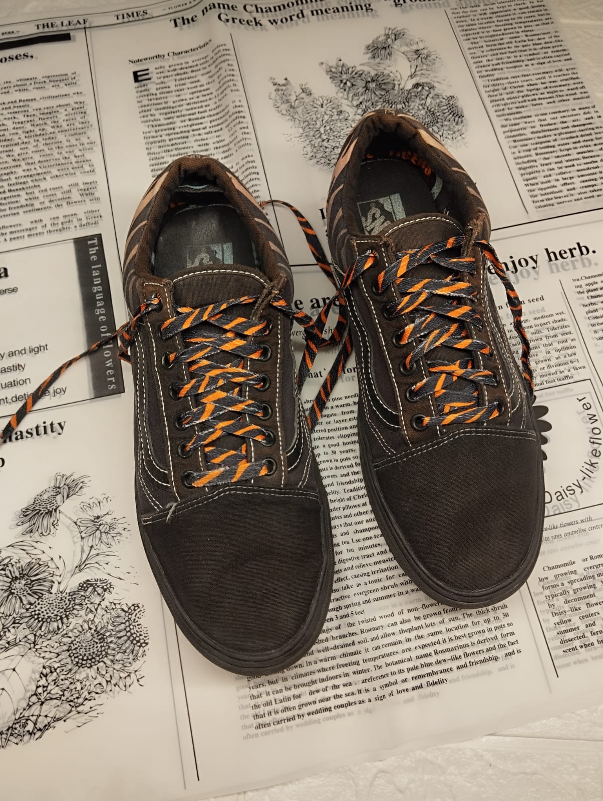 Black and orange low rise vans