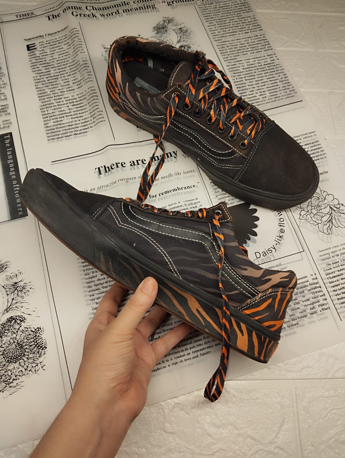 Black and orange low rise vans