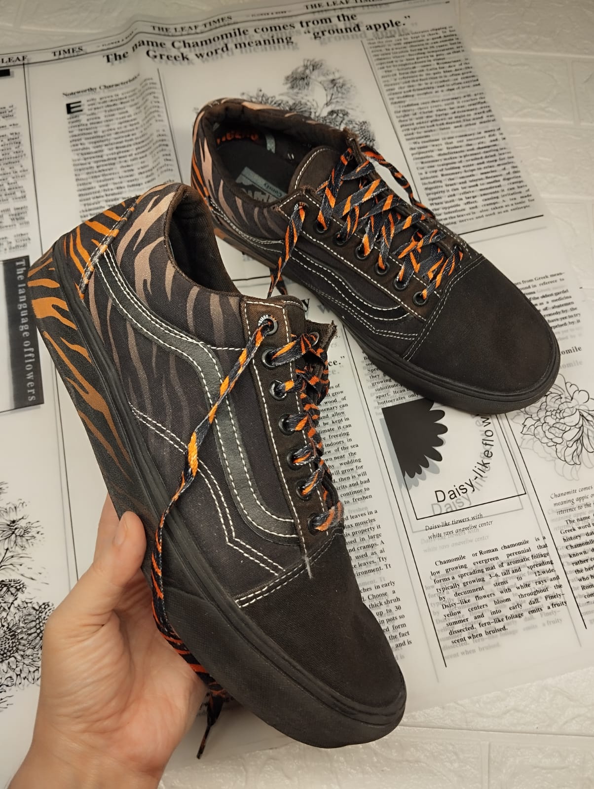 Black and orange low rise vans