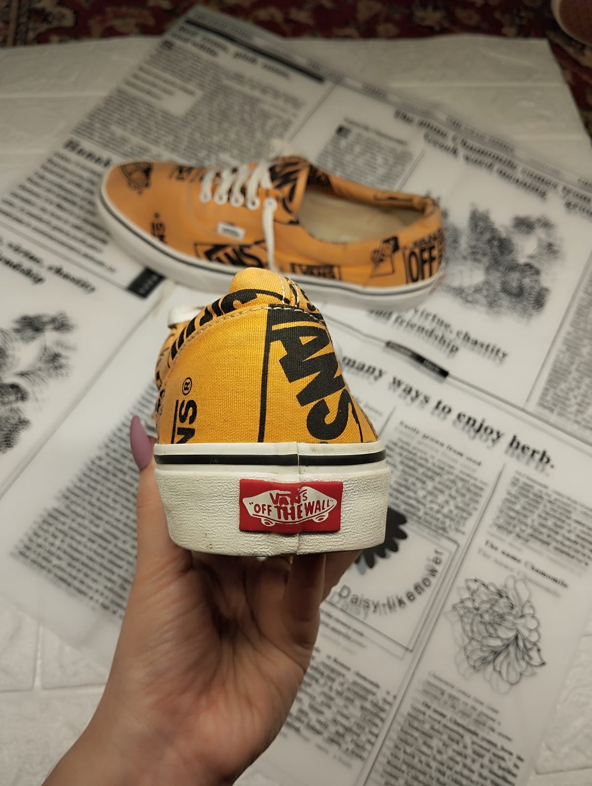 Orange and black low rise vans