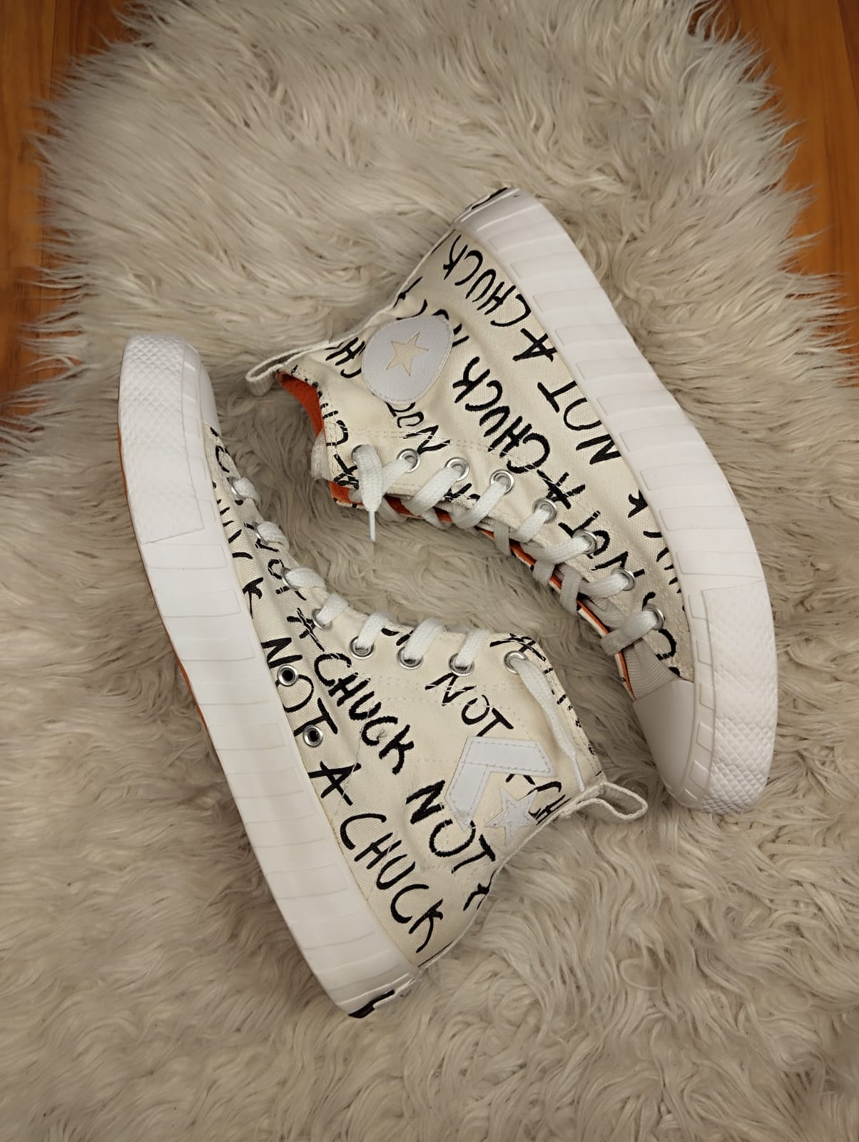 White and orange high rise converse