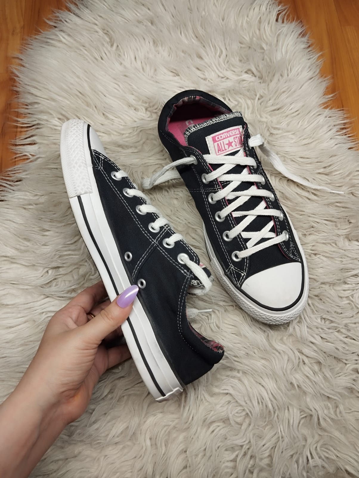Black and pink low rise converse