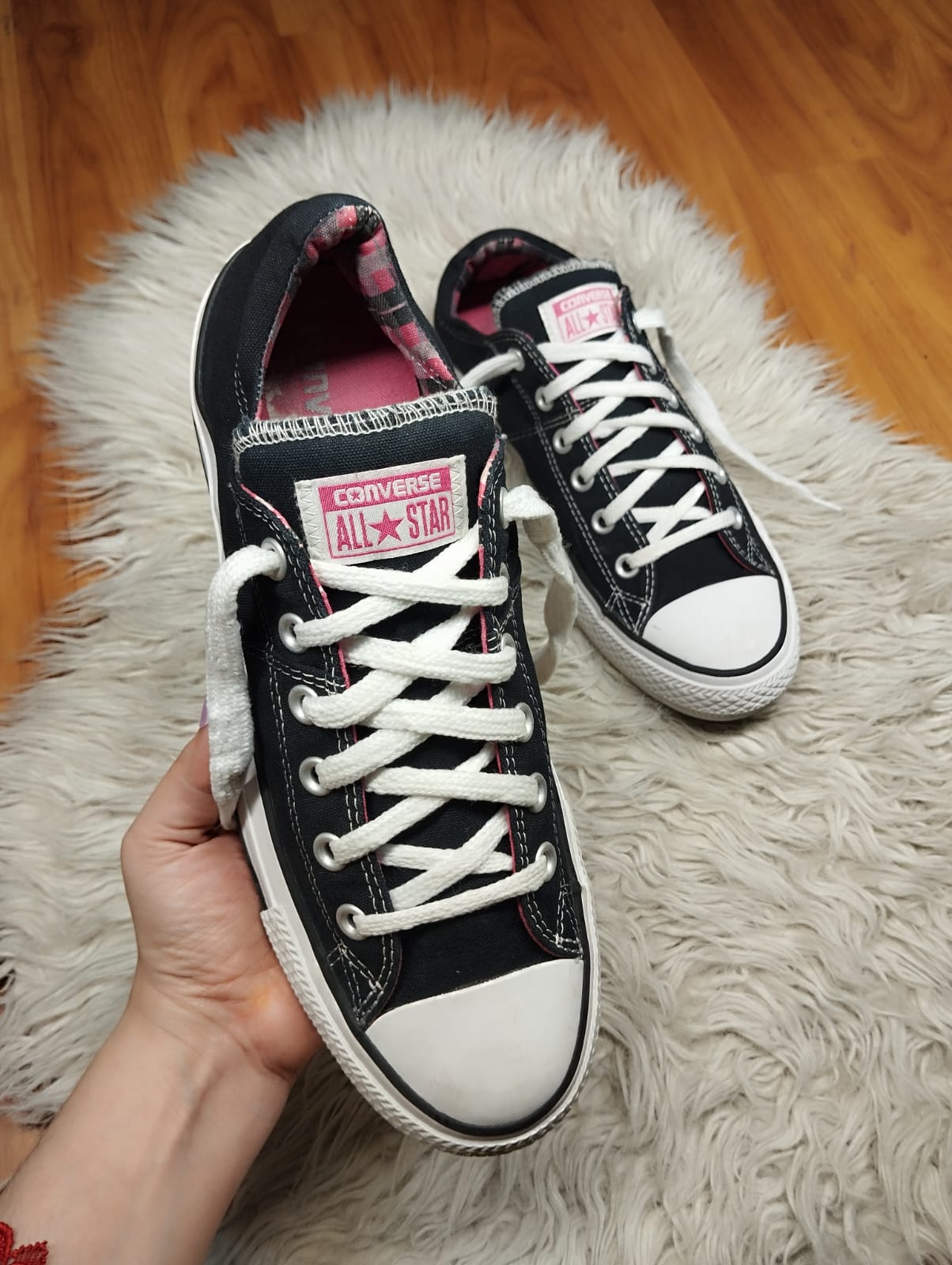 Black and pink low rise converse