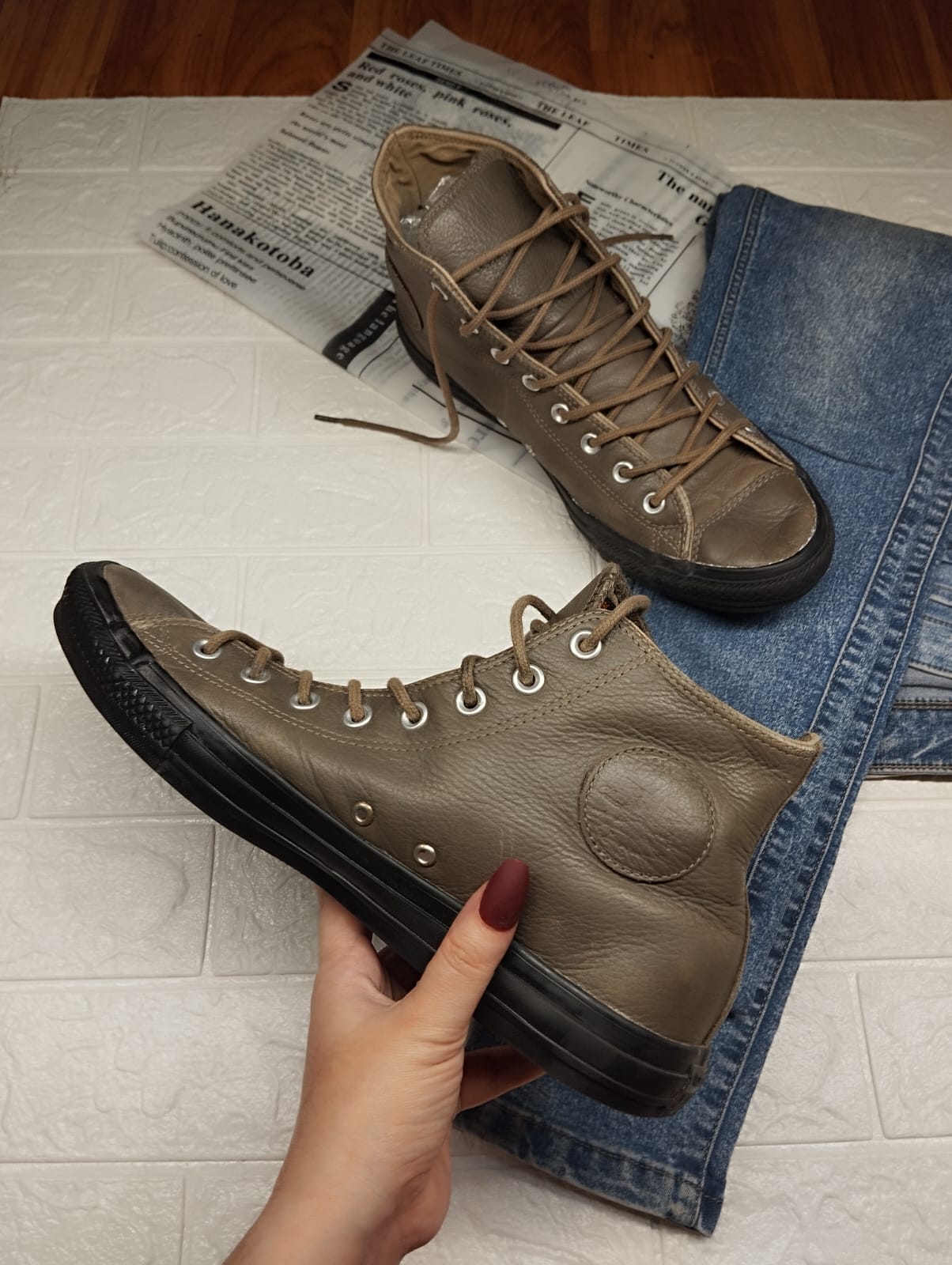 Brown and black leather high rise converse