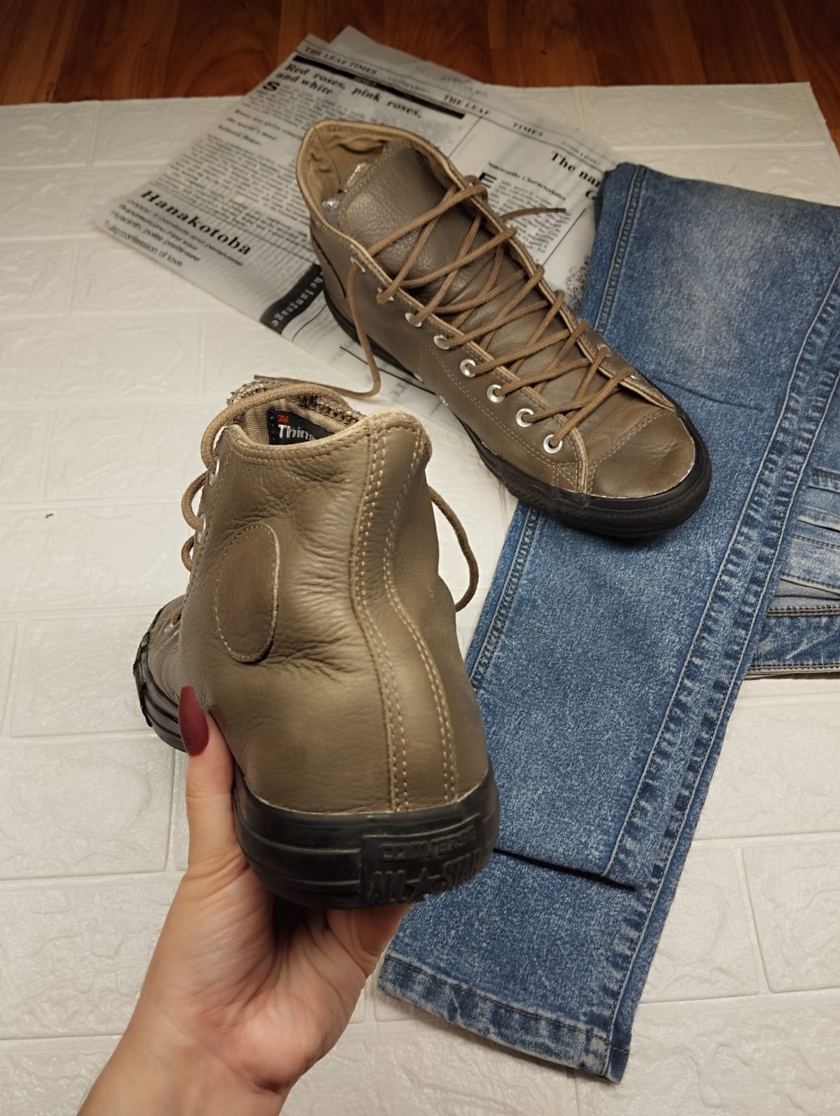 Brown and black leather high rise converse