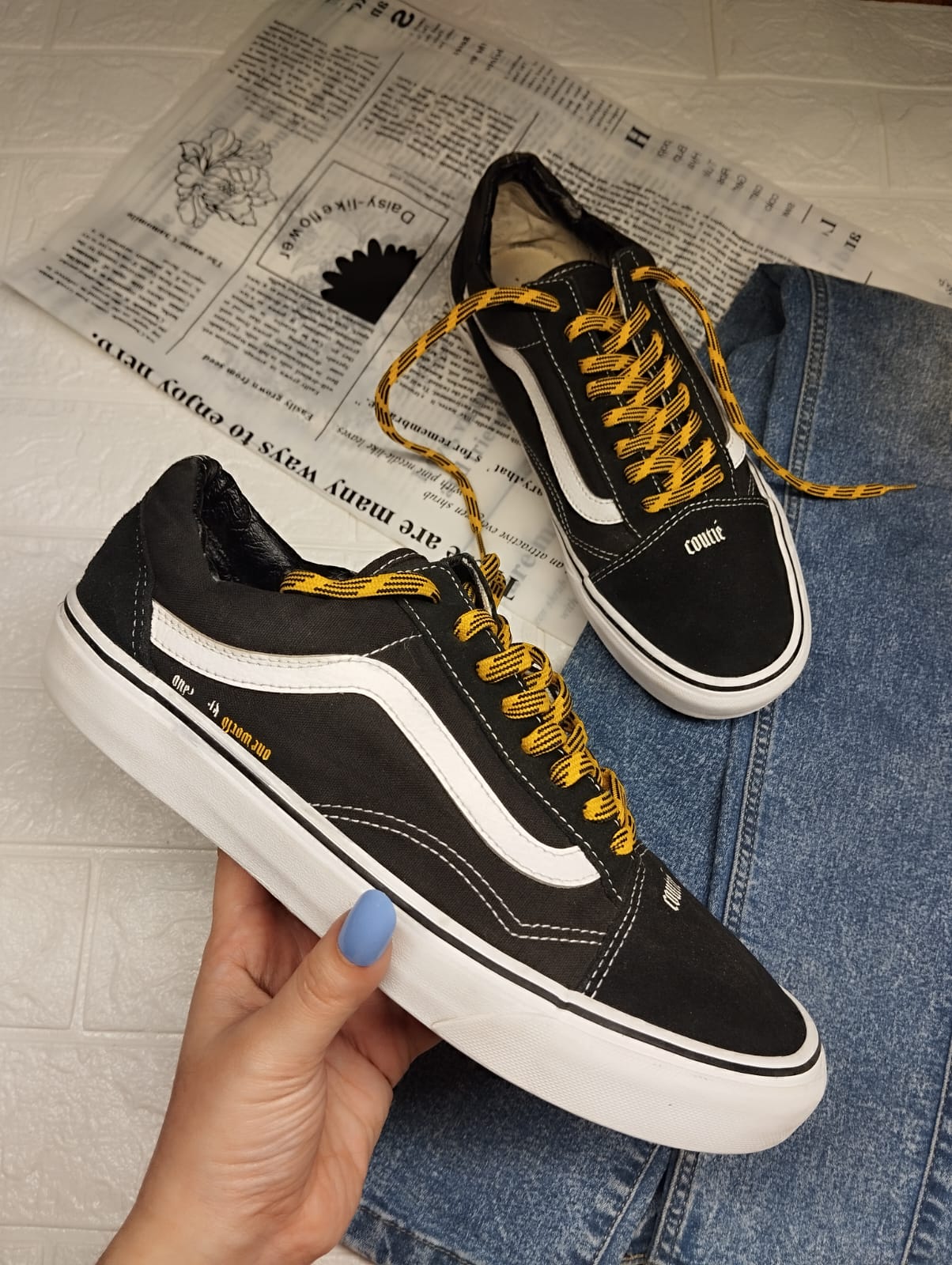 Black and yellow low rise vans