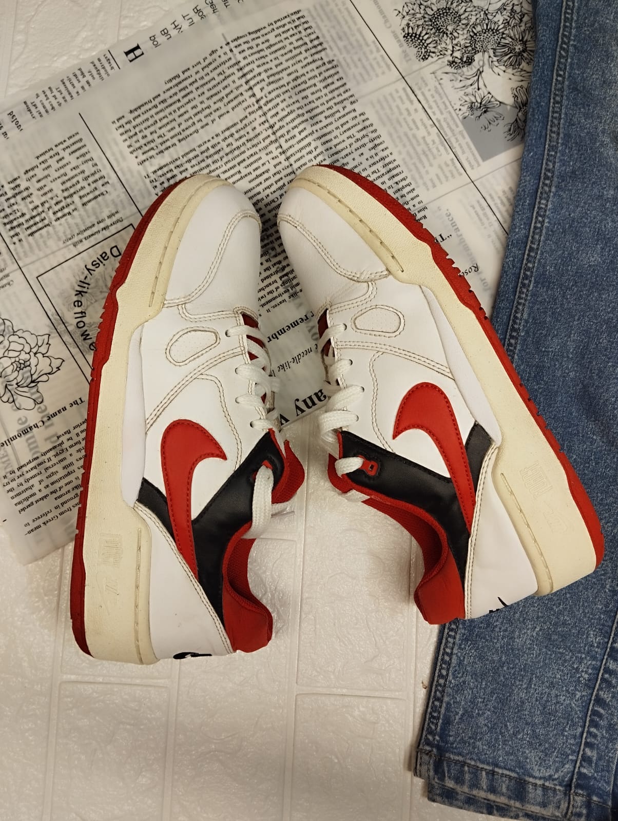 Red and white nike sneakers