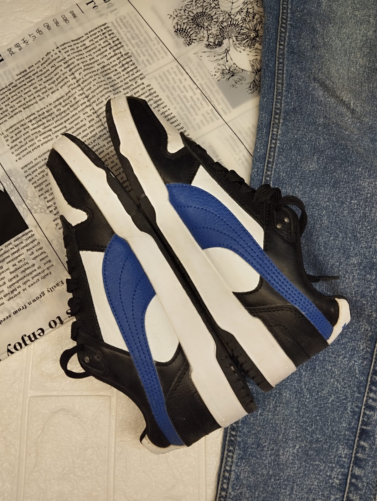Blue and black puma sneakers