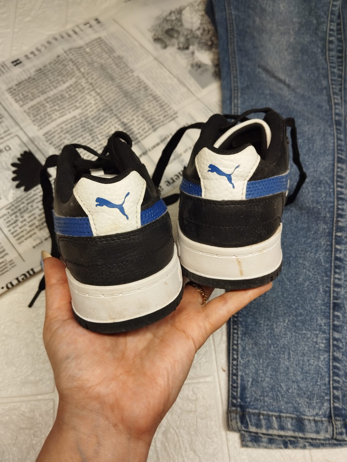 Blue and black puma sneakers