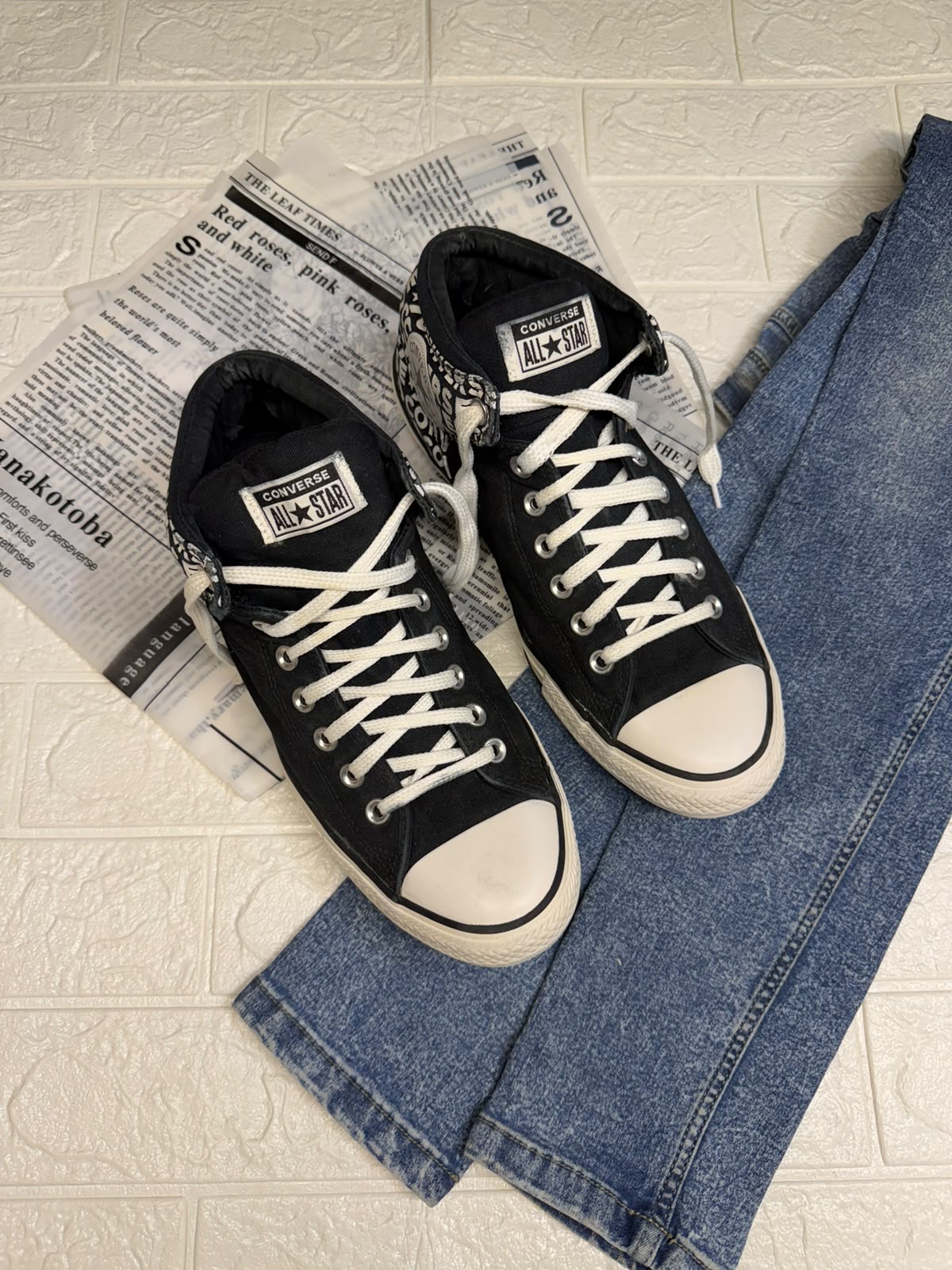 Black and white ankle cut converse