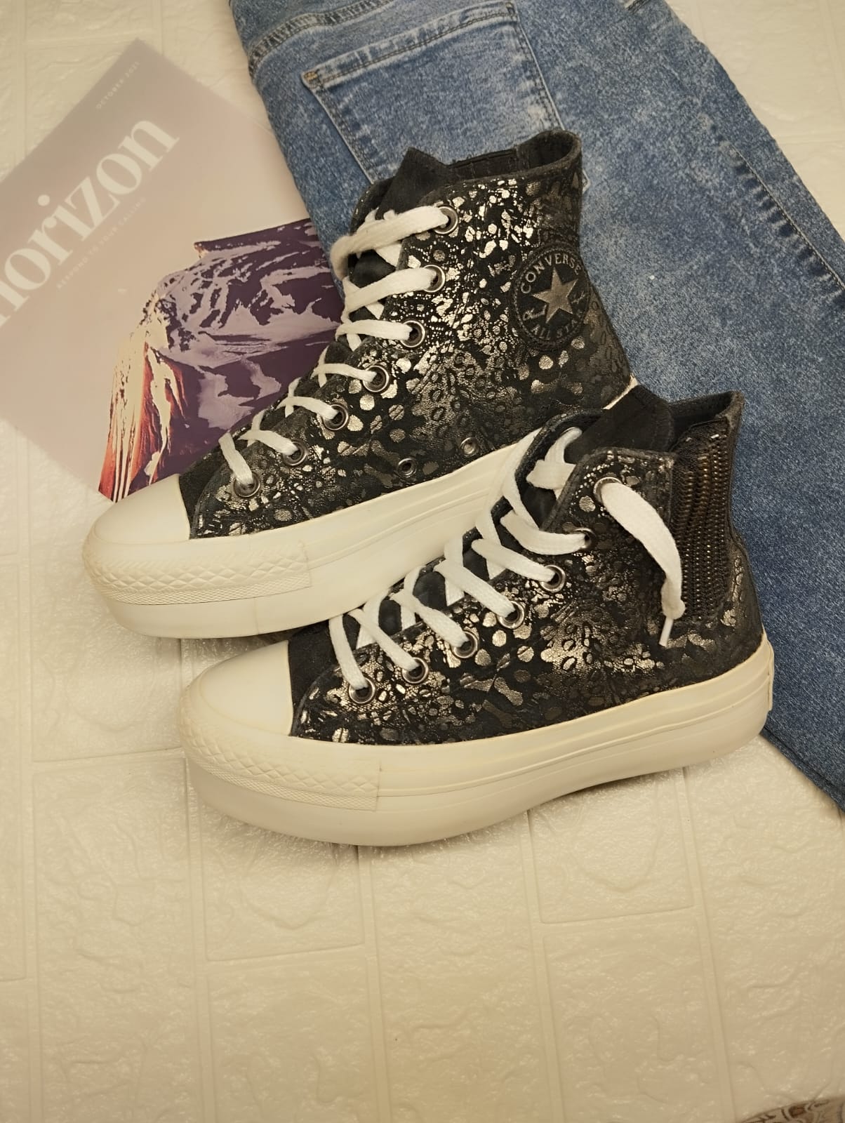 Silver and black high rise platform