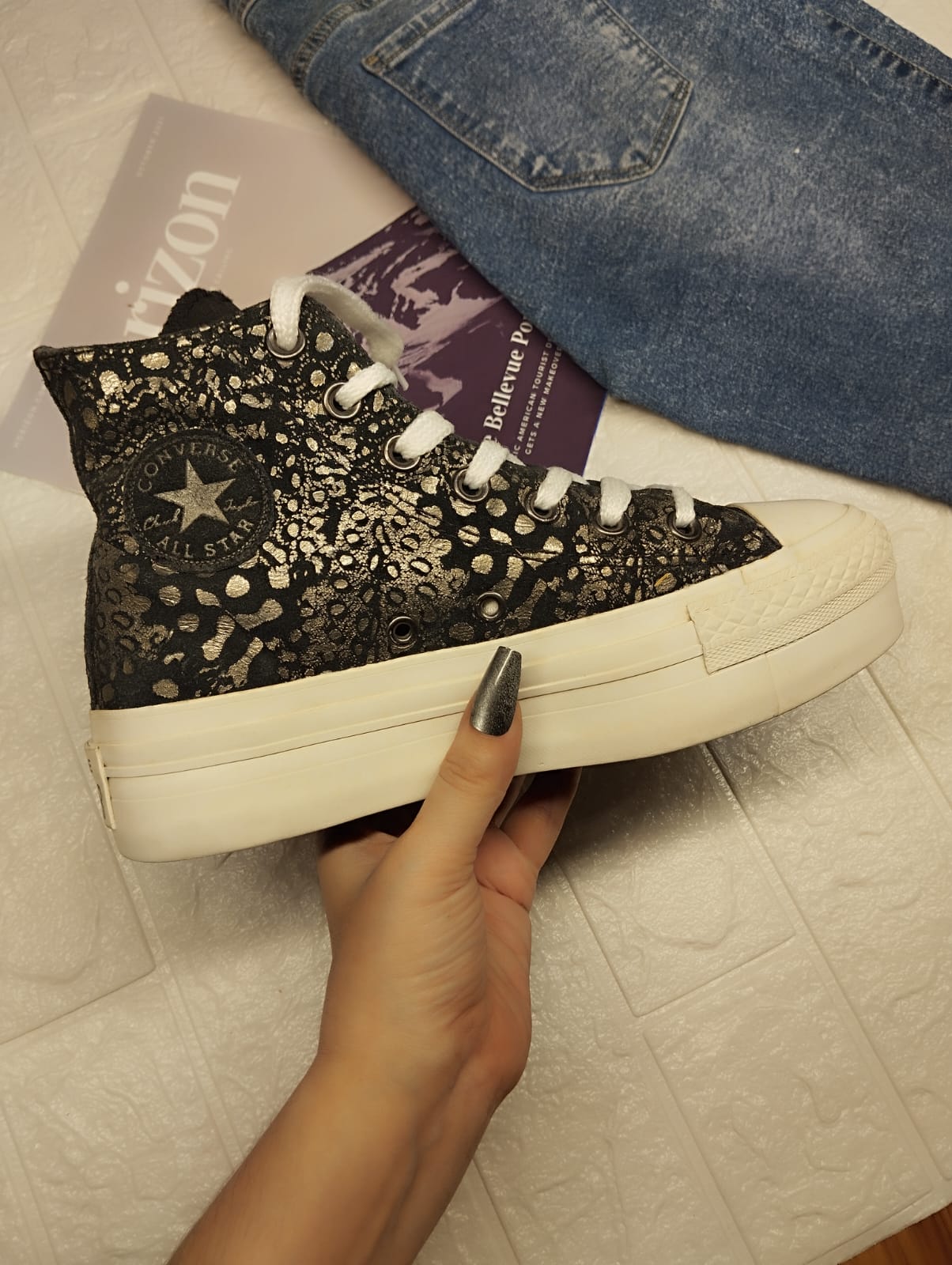 Silver and black high rise platform