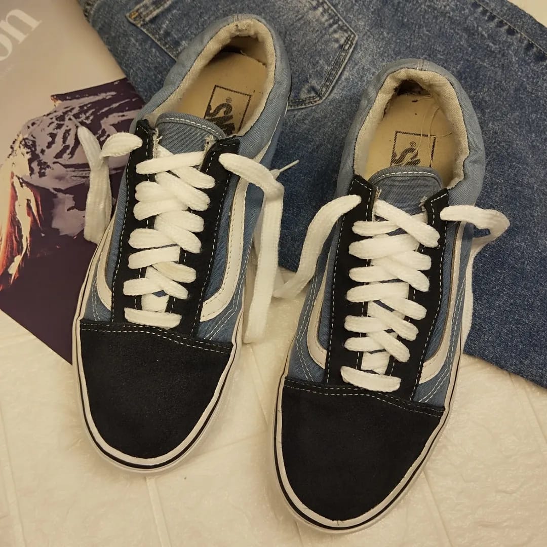 Black and blue low rise vans