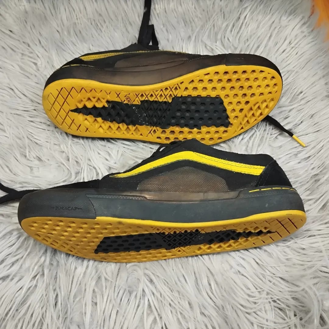 Black and gold low rise vans