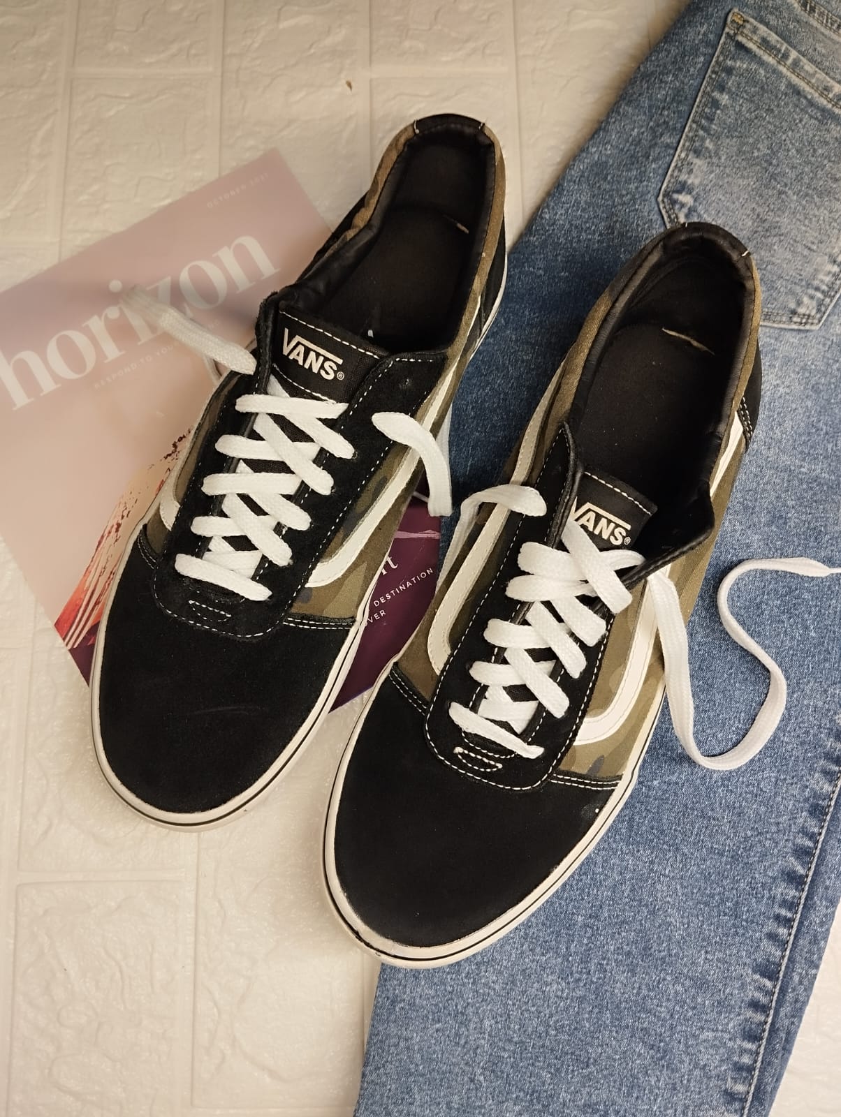 Black and brown low rise vans